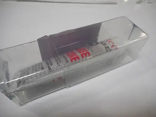 Transparente Verpackung mit Remeha O-Ring Fett, was teilweise sichtbar ist. Die Verpackung zeigt Messskalen und Informationen des Produkts auf der Innenseite.
